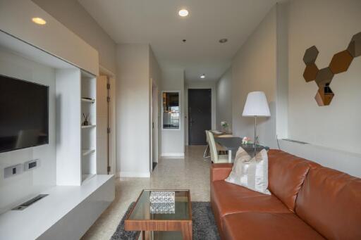 modern living room with a leather sofa and entertainment unit