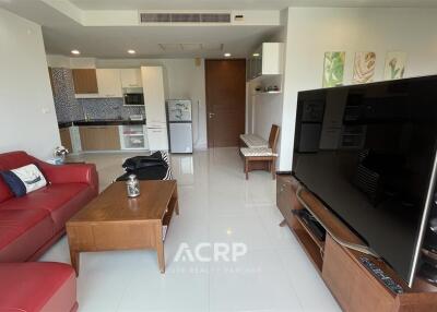 Modern living room with open kitchen and dining area