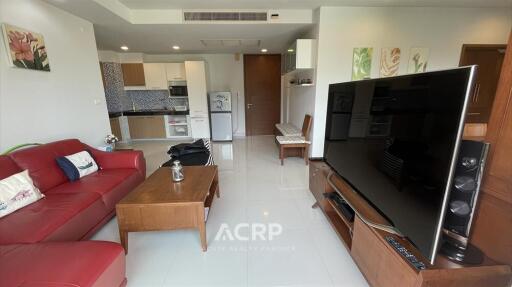 Modern living room with open kitchen and dining area