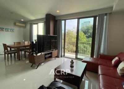 Modern living room with dining area and large windows