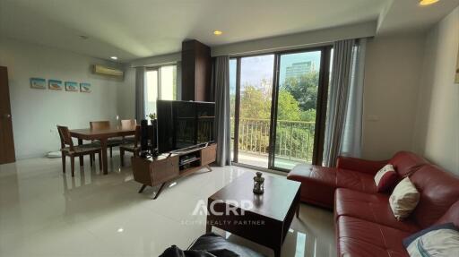 Modern living room with dining area and large windows