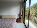 Bedroom with Balcony and Large Window