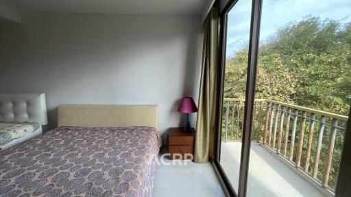 Bedroom with Balcony and Large Window