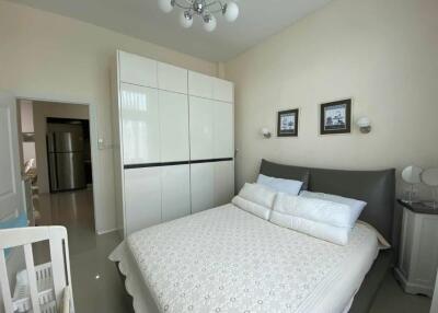 Modern bedroom with wardrobe and bed