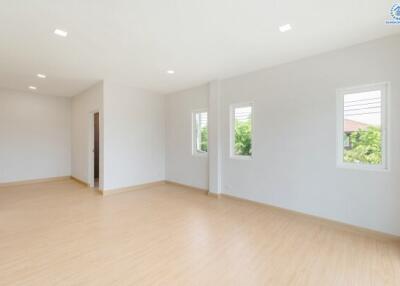 Spacious bedroom with large windows