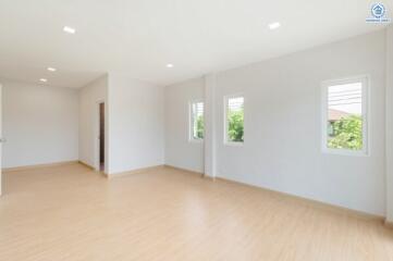 Spacious bedroom with large windows