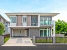 Two-story modern house with driveway and front yard