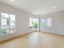 Spacious empty bedroom with large windows