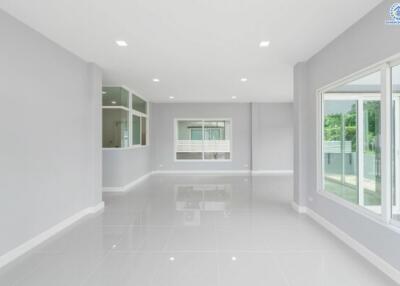 Modern and spacious living area with large windows