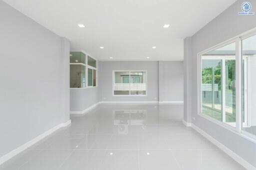 Modern and spacious living area with large windows