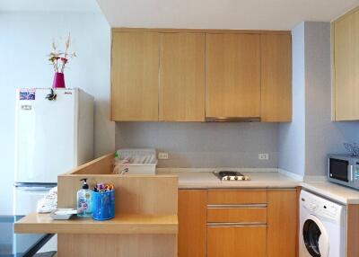 Modern kitchen with wooden cabinets and appliances