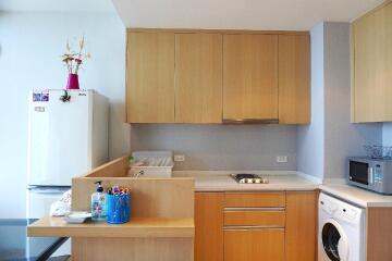 Modern kitchen with wooden cabinets and appliances