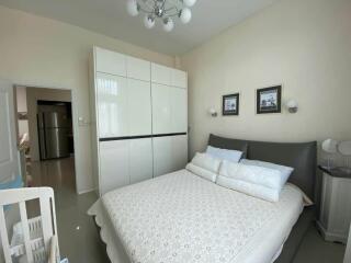 Spacious bedroom with modern decor and ample storage