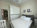 Spacious bedroom with modern decor and ample storage