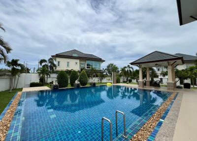 Spacious outdoor pool area with pavilion