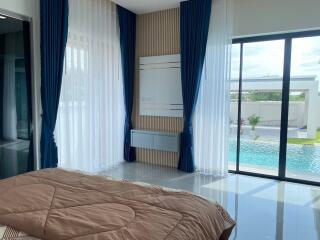 Bedroom with pool view