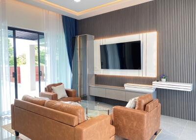 Modern living room with leather sofas and a flat screen TV