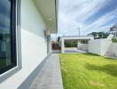 Outdoor view with lawn and covered parking