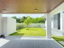 covered patio area looking out to a well-maintained backyard