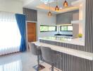 Modern kitchen with breakfast bar and stylish lighting