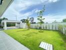 Beautifully landscaped garden with green lawn and trees