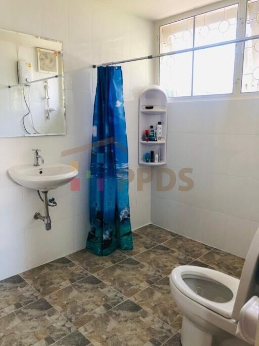 Bathroom with sink, mirror, toilet and shower