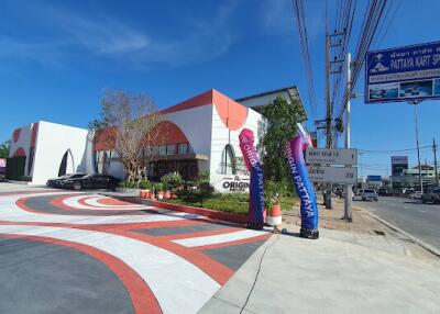 Front view of a modern building with colorful geometric designs