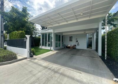 Modern house exterior with carport