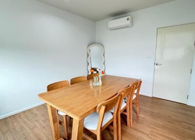 Dining area with wooden table and chairs