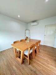 Dining area with wooden table and chairs