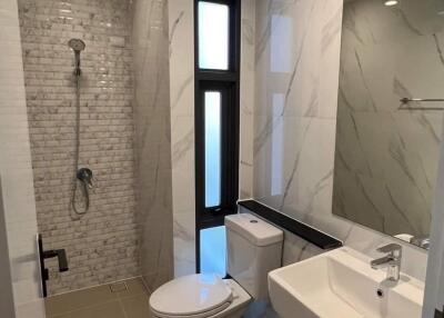 Modern bathroom with a walk-in shower and large mirror