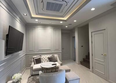 Modern living room with elegant furniture and recessed lighting