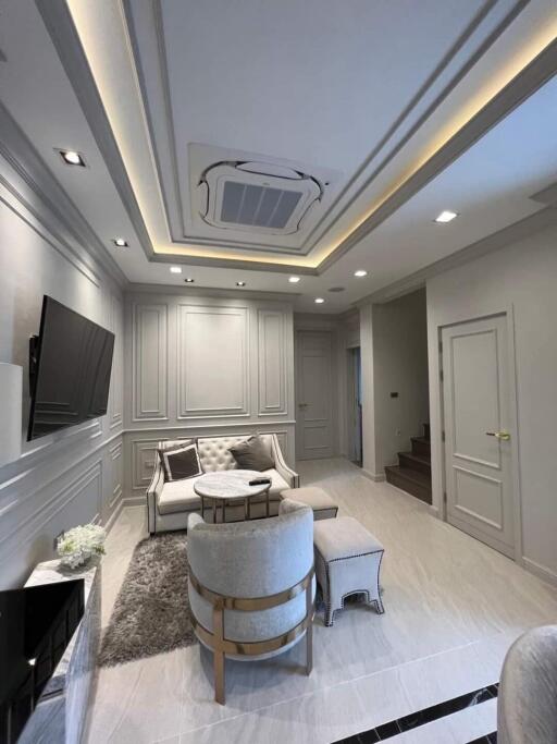 Modern living room with elegant furniture and recessed lighting