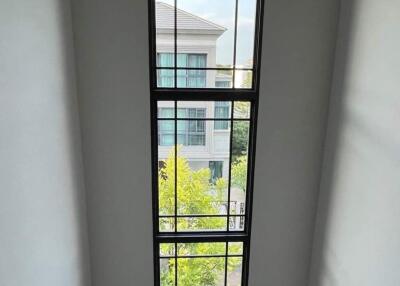 Tall window in staircase area