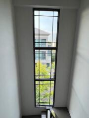 Tall window in staircase area