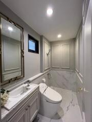 Modern bathroom with large mirror and contemporary fixtures