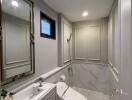 Modern bathroom with large mirror and contemporary fixtures