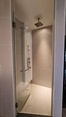 modern shower area with glass door