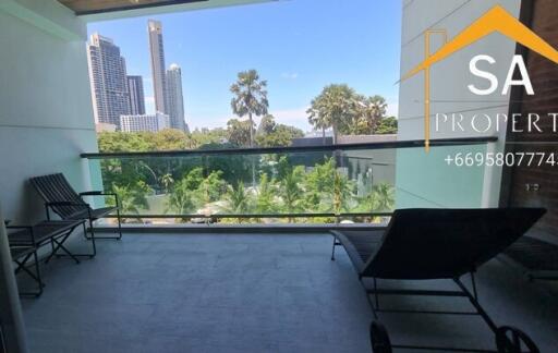 Balcony with a scenic view of the city and surrounding greenery