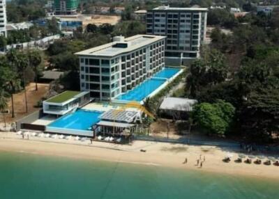 Aerial view of beachfront apartments with swimming pools