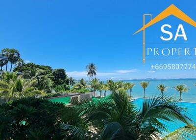 Oceanfront property view with pool and palm trees