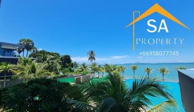 Oceanfront property view with pool and palm trees