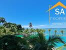 Oceanfront property view with pool and palm trees