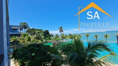 Scenic view of a tropical outdoor area with a swimming pool and ocean backdrop