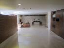 Modern apartment lobby with seating area and decorative elements