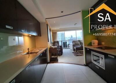 View of the kitchen area leading into the living room