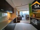 View of the kitchen area leading into the living room