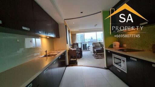 View of the kitchen area leading into the living room