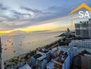 aerial view of a beachfront property at sunset