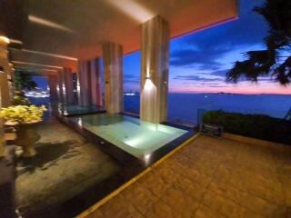 Luxurious outdoor pool area with sunset view